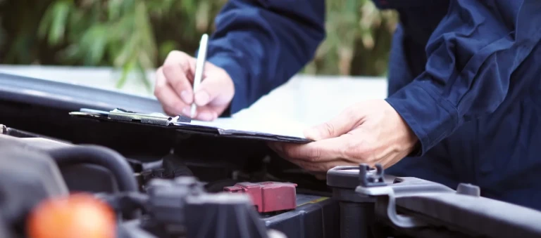 Engineer Checking Car for MOT